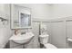 Updated powder room with a gray vanity, white toilet, and stylish decor offers modern comfort at 4905 Andover Pkwy, Westfield, IN 46062