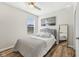 Cozy bedroom featuring a plush bed, ample natural light, and stylish decor at 4905 Andover Pkwy, Westfield, IN 46062