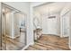 Bright foyer with wood floors, a chandelier, and decorative mirrors creating an open and inviting entrance at 4905 Andover Pkwy, Westfield, IN 46062