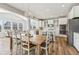 Open-concept kitchen featuring white cabinets, stainless steel appliances, and a seamless transition to the dining area at 4905 Andover Pkwy, Westfield, IN 46062