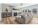 Inviting living room featuring a modern fireplace, large windows, and a comfortable sectional sofa at 4905 Andover Pkwy, Westfield, IN 46062