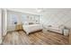 Spacious primary bedroom with natural light, decorative wall, and beautiful wood flooring at 4905 Andover Pkwy, Westfield, IN 46062