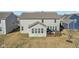 Spacious home with a large wooden deck and sunroom, perfect for outdoor entertaining and relaxation at 4905 Andover Pkwy, Westfield, IN 46062