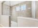 Luxurious walk-in shower featuring custom tile work, dual shower heads, and a glass enclosure at 4905 Andover Pkwy, Westfield, IN 46062