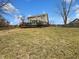 Expansive backyard with a lush lawn and mature trees, ideal for outdoor activities at 5107 Stirling Point Dr, Indianapolis, IN 46241