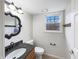 Bathroom featuring a decorative mirror, granite countertop, and a window at 5107 Stirling Point Dr, Indianapolis, IN 46241