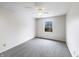 Cozy bedroom with neutral colors, carpet floors, and a window offering natural light at 5107 Stirling Point Dr, Indianapolis, IN 46241