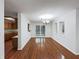 Bright dining room with wood floors and a view to the kitchen and backyard at 5107 Stirling Point Dr, Indianapolis, IN 46241