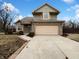 Charming two-story home with a brick facade and an attached two-car garage at 5107 Stirling Point Dr, Indianapolis, IN 46241