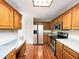Spacious kitchen with stainless steel appliances, wooden cabinets, and light countertops at 5107 Stirling Point Dr, Indianapolis, IN 46241