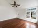 Sun-filled living room with wood floors and a large window at 5107 Stirling Point Dr, Indianapolis, IN 46241