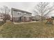 Large, fenced backyard features a concrete patio, mature trees, and ample space for recreation at 5328 Kidwell Cir, Indianapolis, IN 46239
