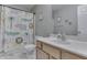 Bright bathroom featuring a vanity with updated faucet and a tub-shower combo with playful shower curtain at 5328 Kidwell Cir, Indianapolis, IN 46239