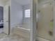 Bathroom featuring a tub and shower at 5328 Kidwell Cir, Indianapolis, IN 46239