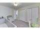 Cozy neutral Bedroom offering a rocking chair and a view into a hallway and another bedroom at 5328 Kidwell Cir, Indianapolis, IN 46239