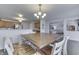 Dining area with a large wooden table open to the kitchen featuring stainless steel appliances at 5328 Kidwell Cir, Indianapolis, IN 46239
