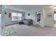 Relaxing living room featuring a comfortable gray sofa with a chaise lounge and an area rug at 5328 Kidwell Cir, Indianapolis, IN 46239