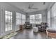 Cozy sunroom featuring plenty of natural light, with modern seating at 5328 Kidwell Cir, Indianapolis, IN 46239