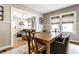 Open dining area offering hardwood floors, a glimpse into the living room, and an adjacent seating area at 5432 Winthrop Ave, Indianapolis, IN 46220