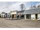A view of the 54th & Monon Shops features several shops in a row with a parking area at 5432 Winthrop Ave, Indianapolis, IN 46220