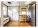 Inviting mud room with built-in bench, storage cubbies, and a door leading to the exterior at 5432 Winthrop Ave, Indianapolis, IN 46220