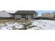 View of backyard with a cozy patio featuring a metal pergola over outdoor seating and a grill at 5443 Alcott Ln, Indianapolis, IN 46221