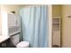 Cozy bathroom with cubbies and a decorative shower curtain at 5443 Alcott Ln, Indianapolis, IN 46221