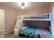 Bright bedroom featuring a bunk bed and vinyl floors at 5443 Alcott Ln, Indianapolis, IN 46221