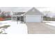 Charming single-story home featuring a two-car garage and covered porch, perfect for suburban living at 5443 Alcott Ln, Indianapolis, IN 46221