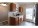 Efficient kitchen with ample counter space, light wood cabinetry, and modern appliances for culinary creations at 5443 Alcott Ln, Indianapolis, IN 46221