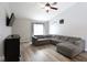 Cozy living room with vaulted ceilings, large sectional sofa, and entertainment center at 5443 Alcott Ln, Indianapolis, IN 46221