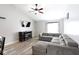 Comfortable living room with a large sectional, fireplace, and mounted TV at 5443 Alcott Ln, Indianapolis, IN 46221