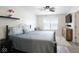 Spacious main bedroom with hardwood floors, natural light, and contemporary furnishings at 5443 Alcott Ln, Indianapolis, IN 46221