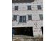 Exterior of an unfinished home with visible windows and a covered entrance, still under construction at 5740 Birtz Rd, Lawrence, IN 46216