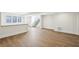 Large basement with hardwood flooring, modern windows, and staircase at 580 Exmoor Dr, Carmel, IN 46032