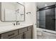 Modern bathroom with gray vanity, shower, and sleek finishes at 580 Exmoor Dr, Carmel, IN 46032