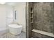 Bathroom featuring a soaking tub and tiled walk-in shower with a built-in bench at 580 Exmoor Dr, Carmel, IN 46032