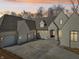 An aerial view of this new construction shows an elegant facade and two-car garage with a concrete driveway at 580 Exmoor Dr, Carmel, IN 46032