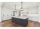 Spacious kitchen features marble countertops, modern appliances, and an oversized central island at 580 Exmoor Dr, Carmel, IN 46032