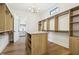 Organized walk-in closet with custom shelving and an island at 580 Exmoor Dr, Carmel, IN 46032