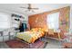 Vibrant bedroom with colorful floral wallpaper, bed, and matching decor at 6015 Pine Hill Dr, Indianapolis, IN 46235