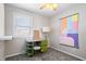 Bedroom with gray carpet, a lamp, and a painted design on the wall at 6015 Pine Hill Dr, Indianapolis, IN 46235