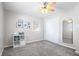 Bright bedroom with a sliding closet door and neutral tones at 6015 Pine Hill Dr, Indianapolis, IN 46235