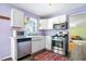 Bright kitchen with stainless steel appliances and purple accents, creating a stylish cooking space at 6015 Pine Hill Dr, Indianapolis, IN 46235
