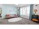 Charming living room featuring unique decor and a large window with sheer curtains at 6015 Pine Hill Dr, Indianapolis, IN 46235