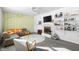 Bright living room features a fireplace and eclectic decor, creating a warm and inviting atmosphere at 6015 Pine Hill Dr, Indianapolis, IN 46235