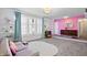 Bright and airy living room with large windows and colorful decor, creating a vibrant space at 6015 Pine Hill Dr, Indianapolis, IN 46235