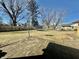 Large backyard with a patio, play set, shed, and fenced perimeter at 6346 Shelby St, Indianapolis, IN 46227