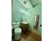 Powder room with modern toilet, vanity, and a framed mirror at 6346 Shelby St, Indianapolis, IN 46227