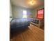 Bedroom featuring two beds, natural light, and hardwood floors at 6346 Shelby St, Indianapolis, IN 46227